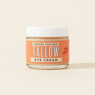 Jar of coffee-infused tallow eye cream on a beige background
