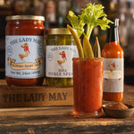 The Lady May garnished Bloody Mary cocktail made with Bloody Mary mix, pickle spears and hot sauce