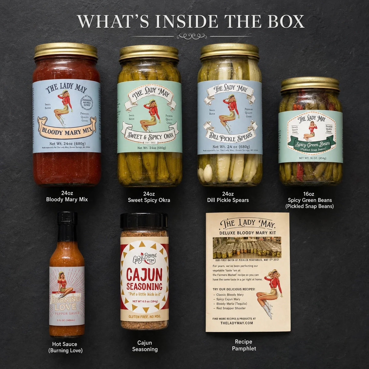 The Lady May Deluxe Bloody Mary Kit contents – Bloody Mary mix, pickled okra, dill pickles, green beans, hot sauce and Cajun seasoning