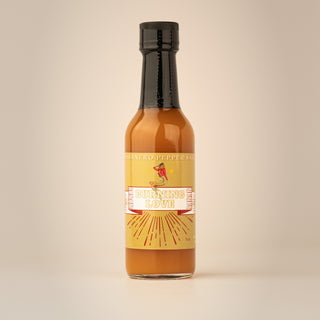 The Lady May Burning Love habanero pepper hot sauce bottle, a gourmet small-batch farm-to-table Southern hot sauce gift idea