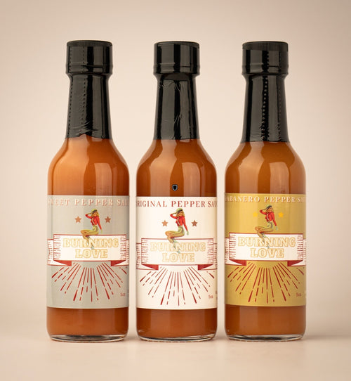 The Lady May Burning Love hot sauce trio of sweet pepper, original and habanero pepper sauce bottles, a gourmet small-batch farm-to-table Southern hot sauce gift idea
