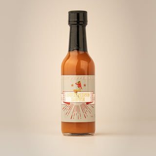 The Lady May Burning Love sweet pepper hot sauce bottle, a gourmet small-batch farm-to-table Southern hot sauce gift idea